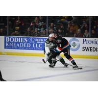 Kelowna Rockets' Max Graham battles Everett Silvertips' Jesse Heslop