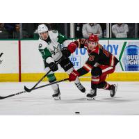 Texas Stars forward Kole Lind (left) vs. the Grand Rapids Griffins