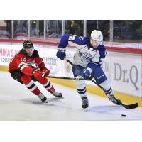 Syracuse Crunch defenseman Declan Carlile (right) vs. the Utica Comets