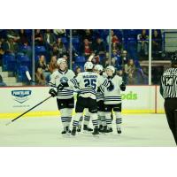 Wenatchee Wild defenseman Brendan Dunphy (left) gathers with his teammates after scoring a goal